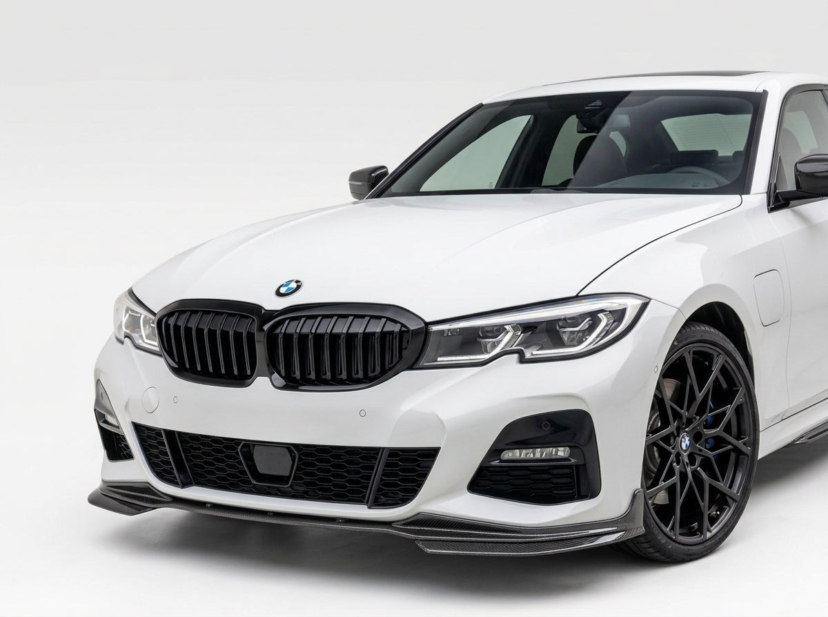 Carbon Corp. carbon fibre MP style front splitter installed on a white BMW 3-Series G20 M-Sport bumper