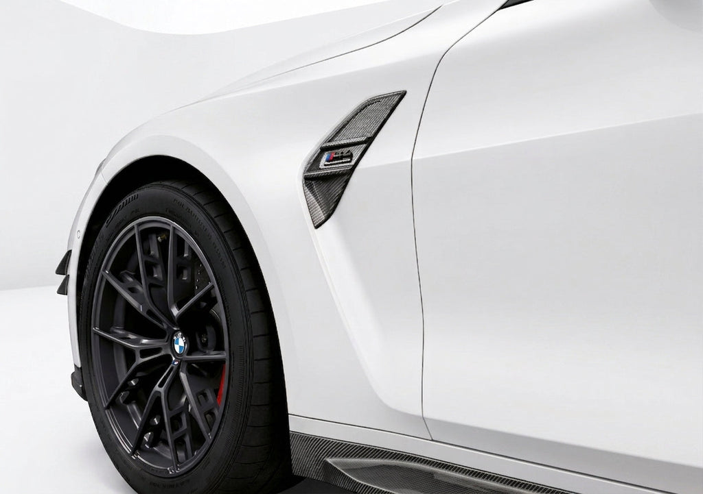 Carbon Corp. carbon fibre side fender trim installed on a white BMW M3 G80 with high-gloss finish