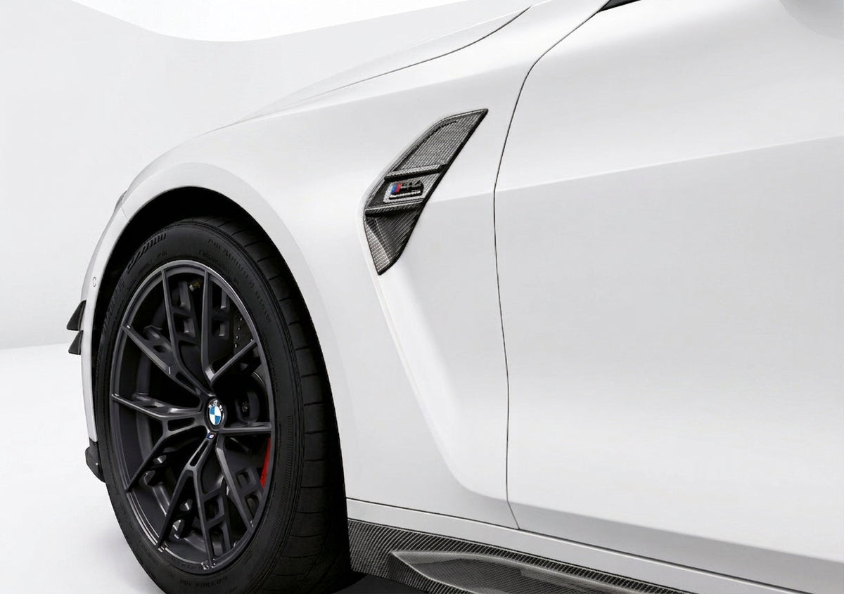 Carbon Corp. carbon fibre side fender trim installed on a white BMW M3 G80 with high-gloss finish