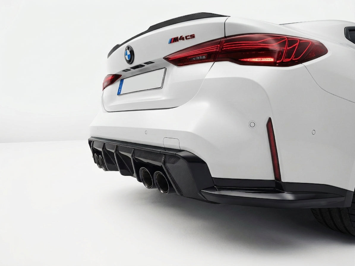Carbon Corp. carbon fibre rear diffuser with aggressive fins on a white BMW M4 G82, showcasing quad exhaust tips.