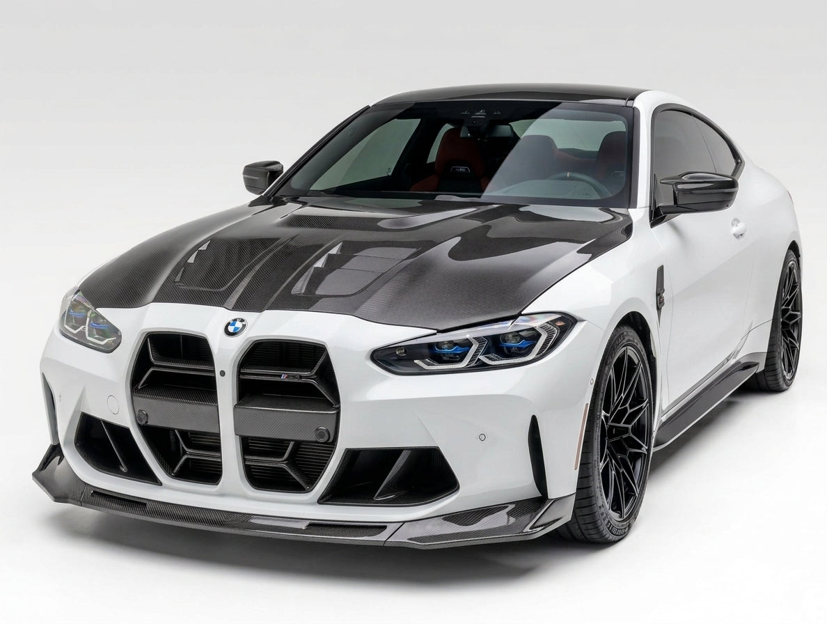 Carbon Corp. V-style carbon fibre front splitter installed on a white BMW M4 G82 with a glossy carbon fibre hood