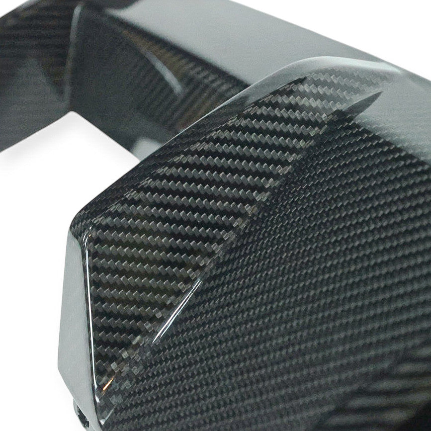 Carbon Corp. BMW M2 G87 carbon fibre rear diffuser with high-gloss finish and aggressive vertical fin design