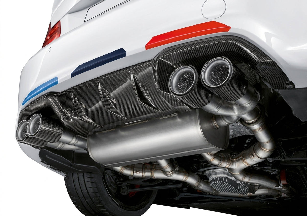 Carbon Corp. M Performance style carbon fibre rear diffuser with aggressive fins on a white BMW M2 F87