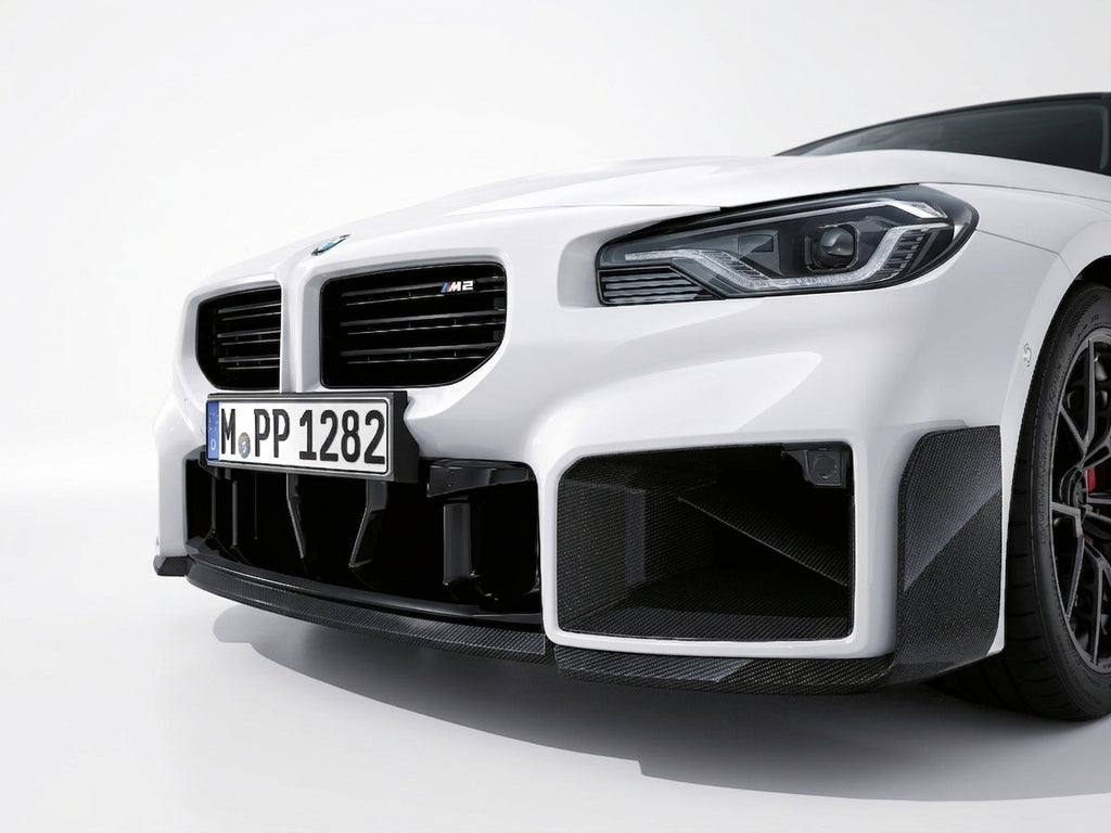 Carbon Corp. glossy carbon fibre front splitter on a white BMW M2 G87 with aggressive winglet design