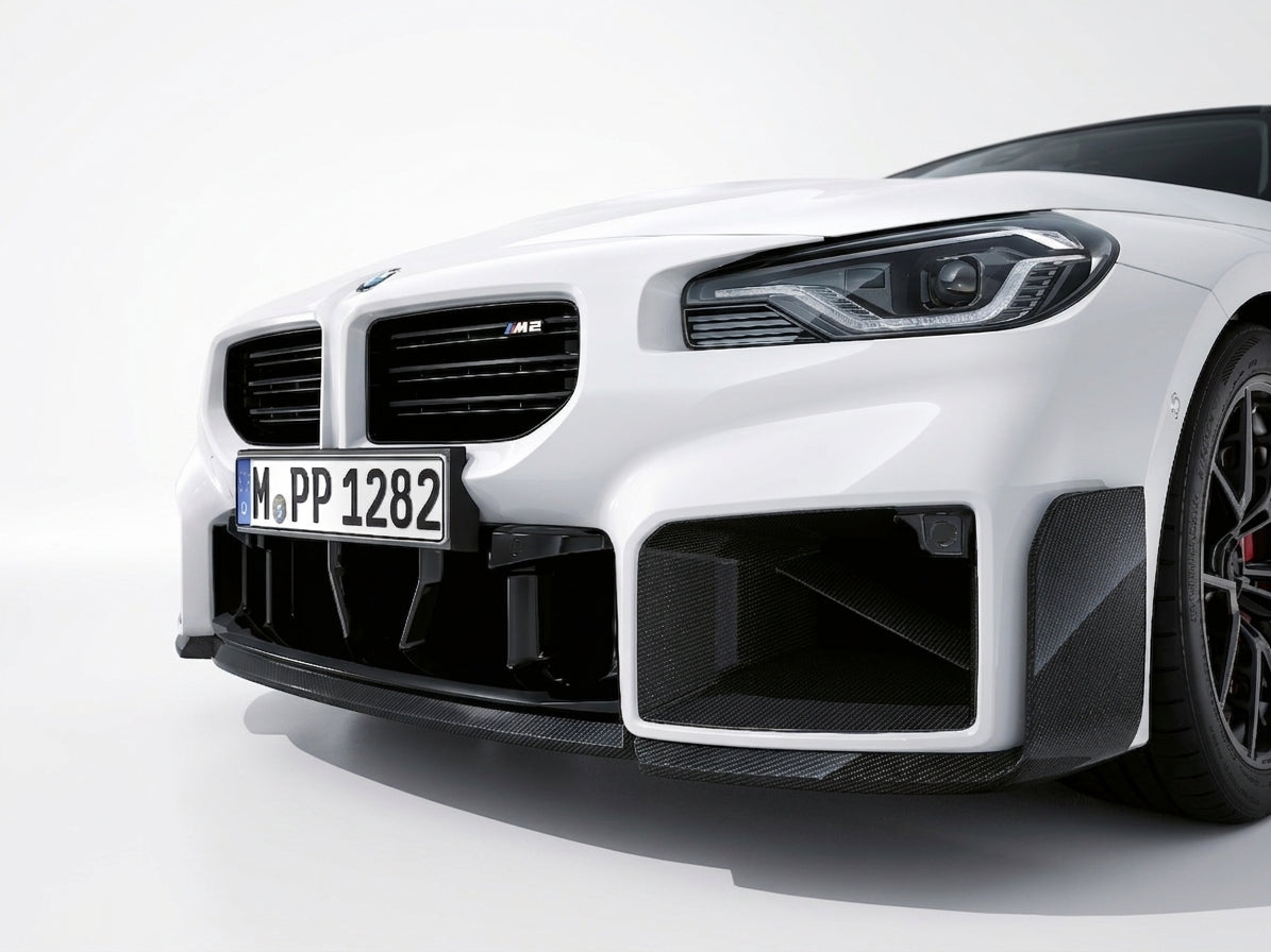 Carbon Corp. glossy carbon fibre front splitter on a white BMW M2 G87 with aggressive winglet design