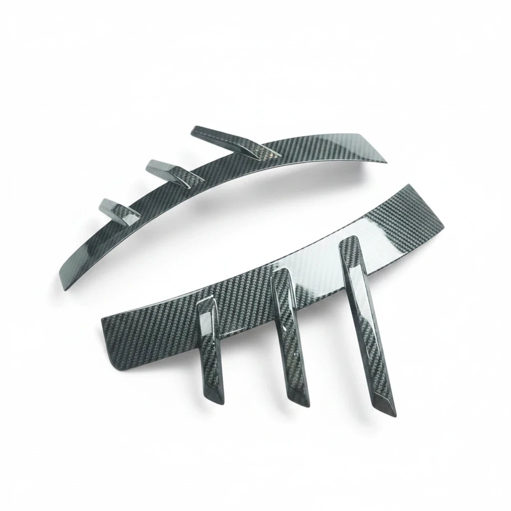 Carbon Corp. glossy carbon fibre rear arch trim for BMW M2 G87 with aggressive MP-style aerodynamic fins