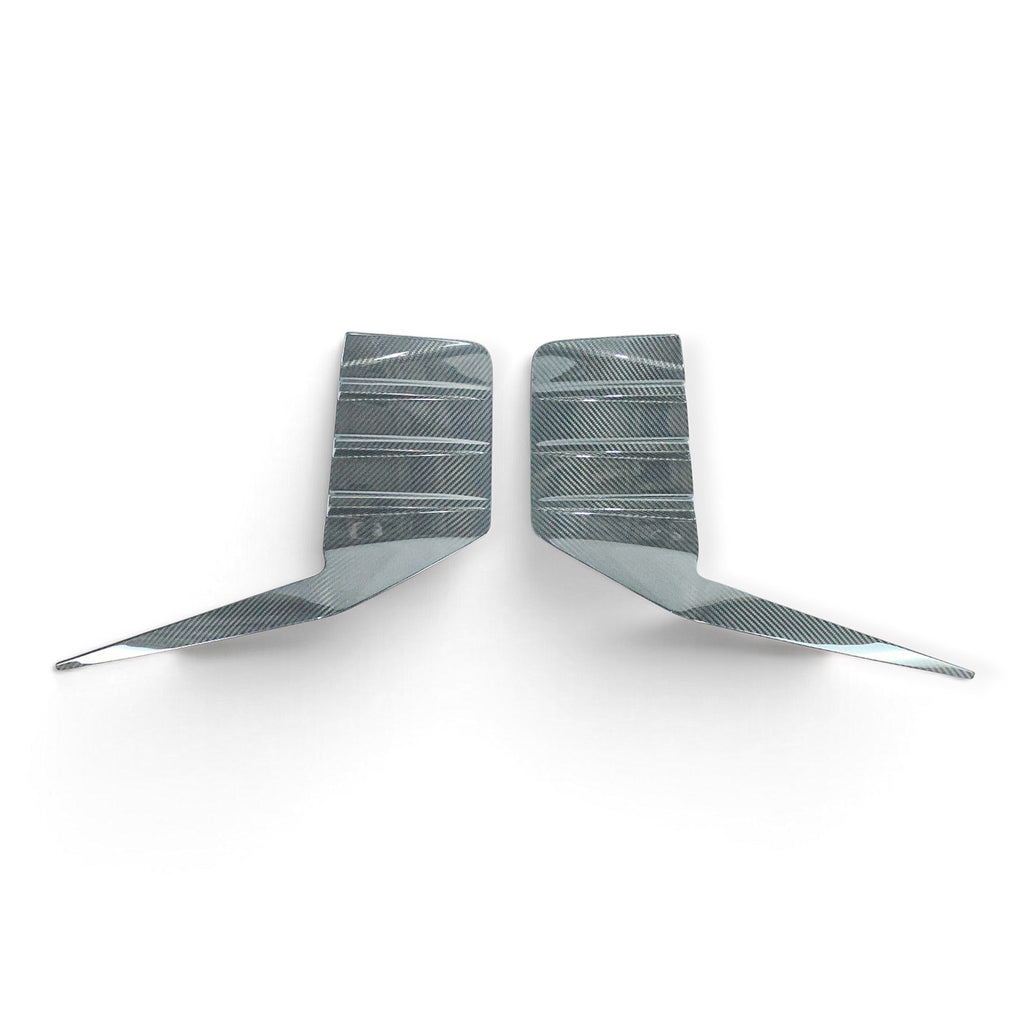 Carbon Corp. BMW M2 G87 carbon fibre rear bumper trim set with a high-gloss finish for a race-inspired look.