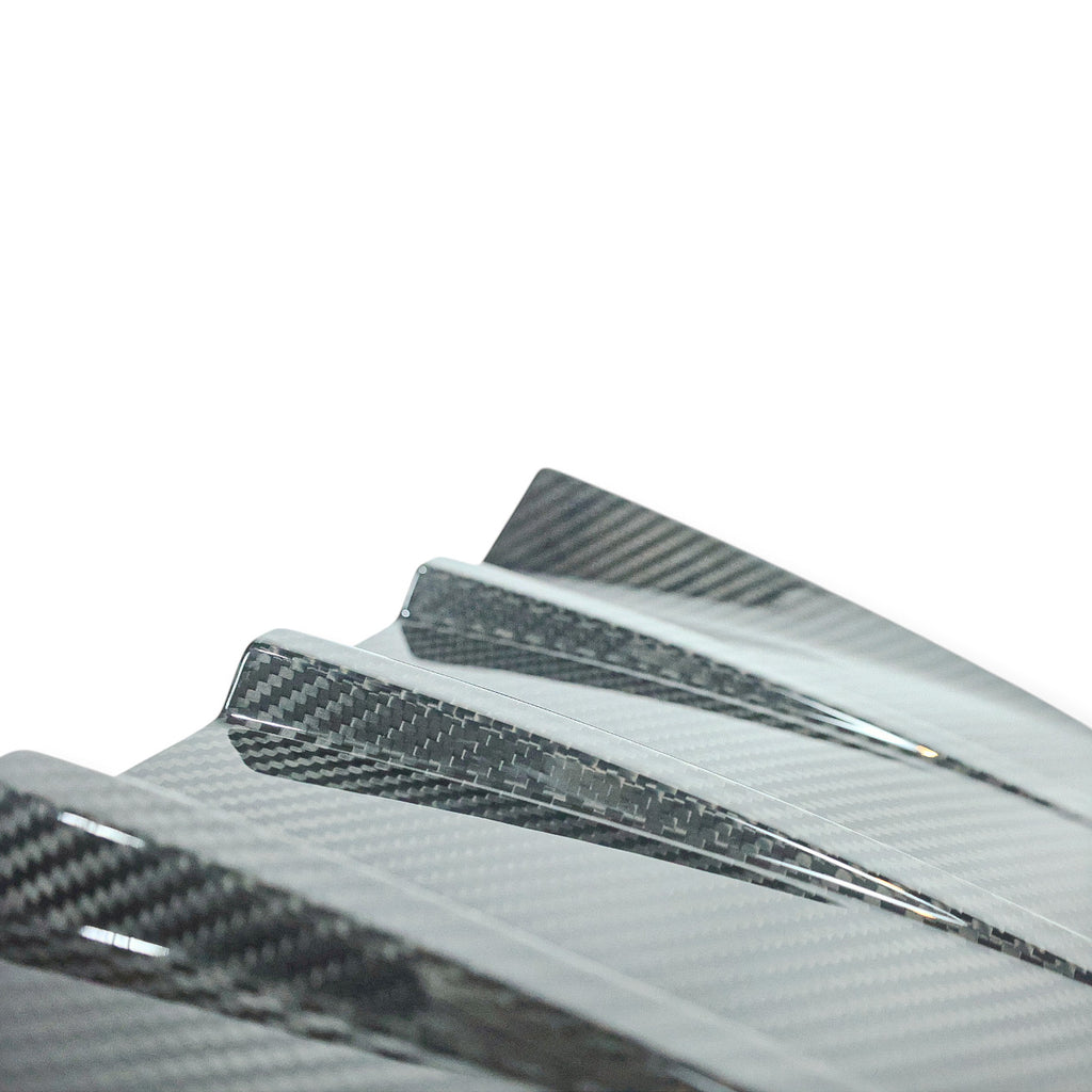 Carbon Corp. BMW M2 G87 carbon fibre rear bumper trim with a high-gloss finish and race-inspired MP style design.