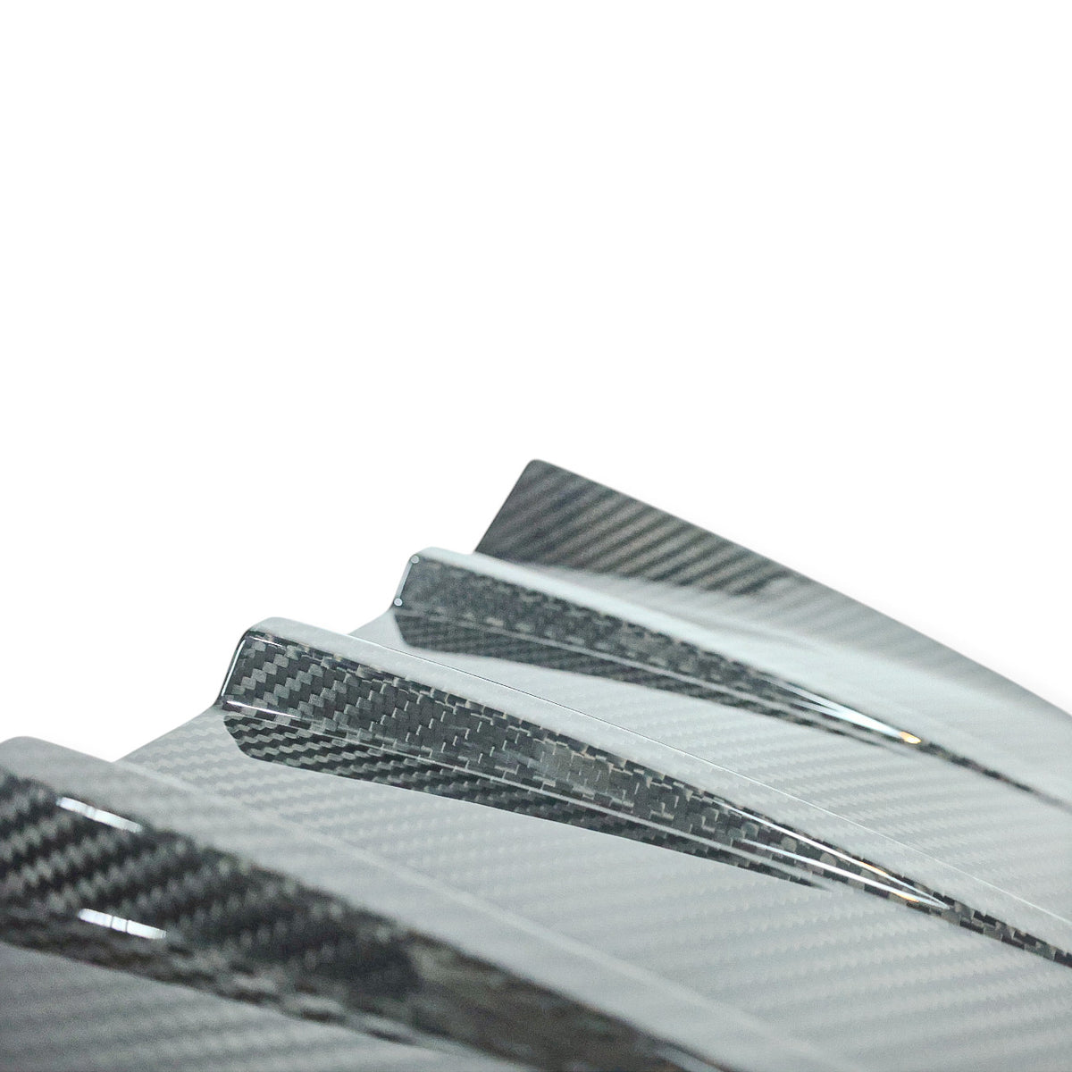 Carbon Corp. BMW M2 G87 carbon fibre rear bumper trim with a high-gloss finish and race-inspired MP style design.
