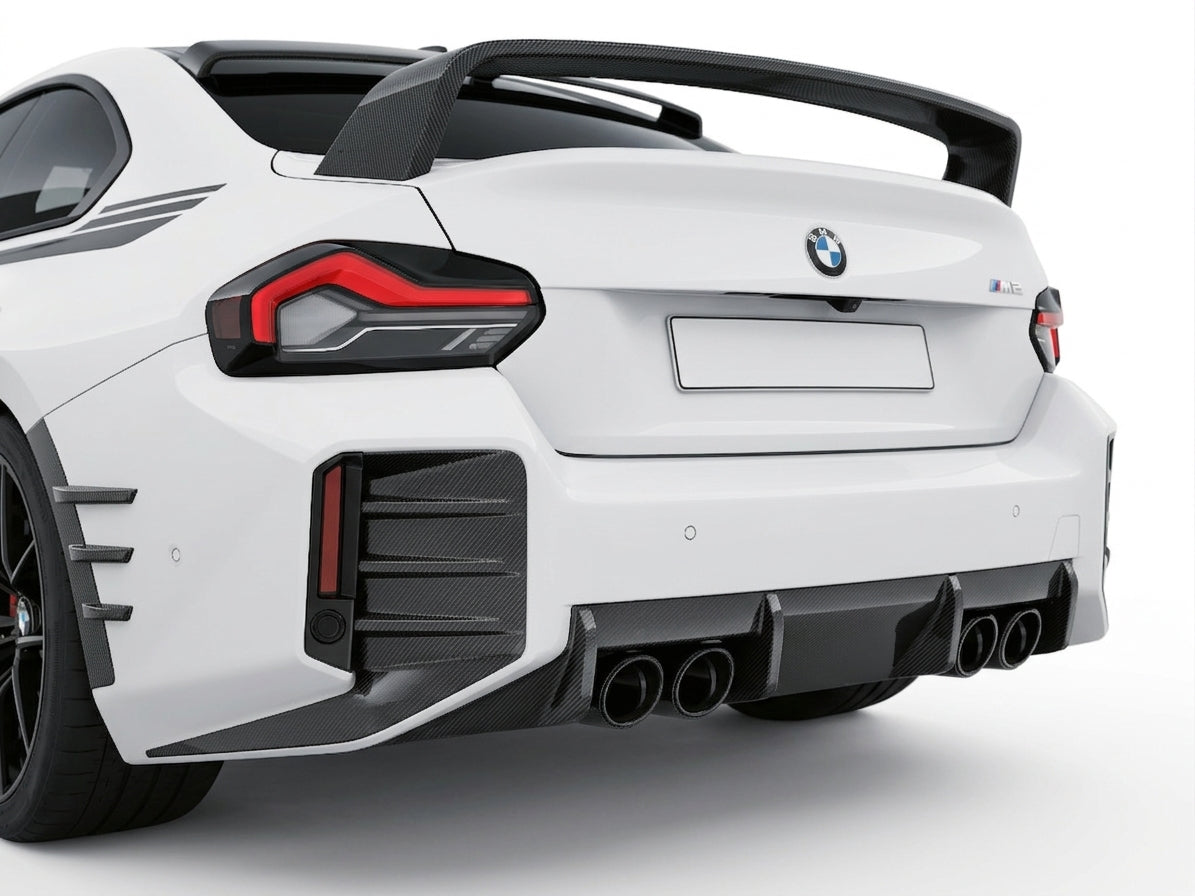 Carbon Corp. BMW M2 G87 carbon fiber rear diffuser with aggressive vertical fins and quad exhaust cutouts