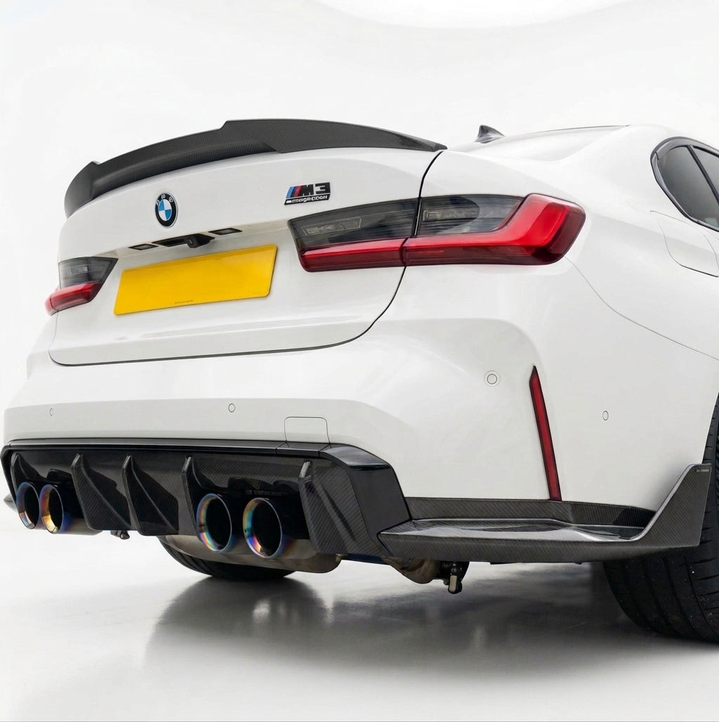 Carbon Corp. V4 carbon fibre high-kick spoiler installed on the rear boot of a white BMW M3 G80 sedan