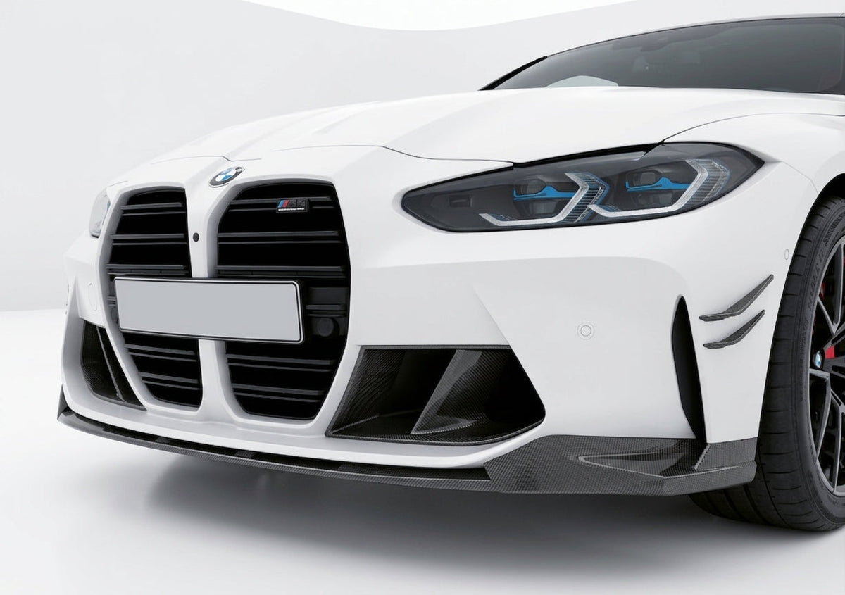 Carbon Corp. MP style carbon fiber front splitter installed on a white BMW M4 G82 sports car