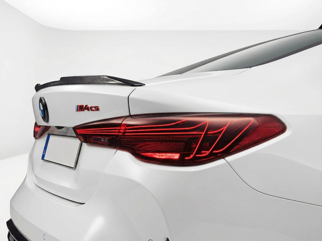 Carbon Corp. gloss carbon fibre MP style lip spoiler installed on the white boot lid of a BMW M4 G82