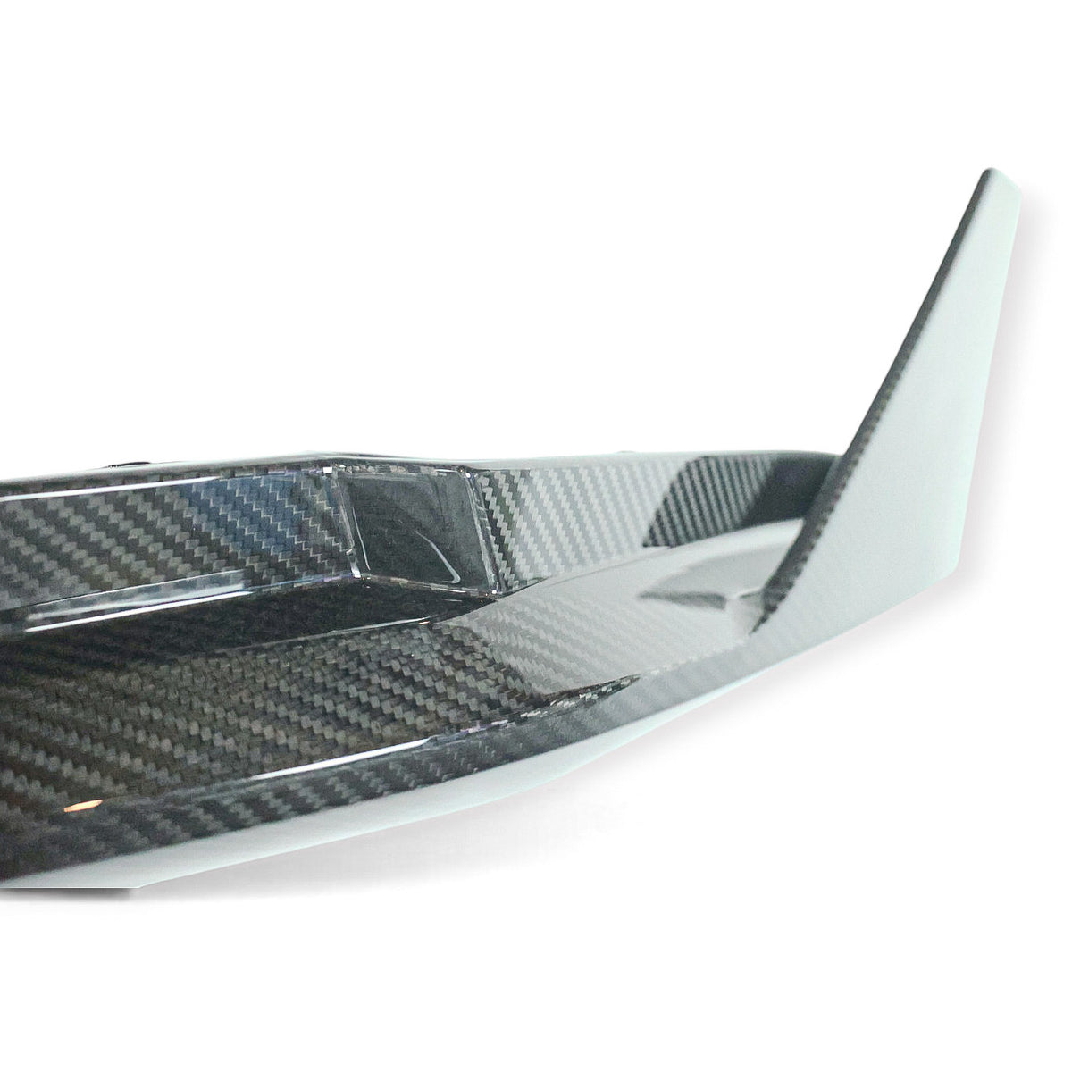 Carbon Corp. MP style carbon fibre rear bumper corner extension for BMW G82 M4 with a glossy weave finish.
