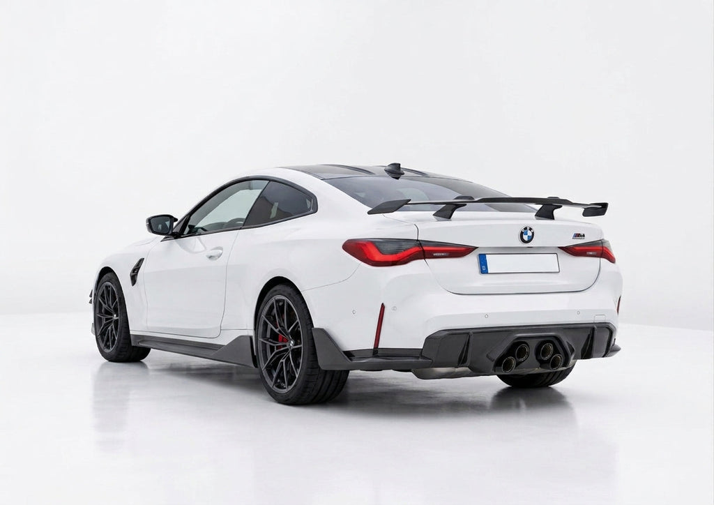 Carbon Corp. gloss carbon fibre MP style rear wing spoiler installed on a white BMW M4 G82 coupe