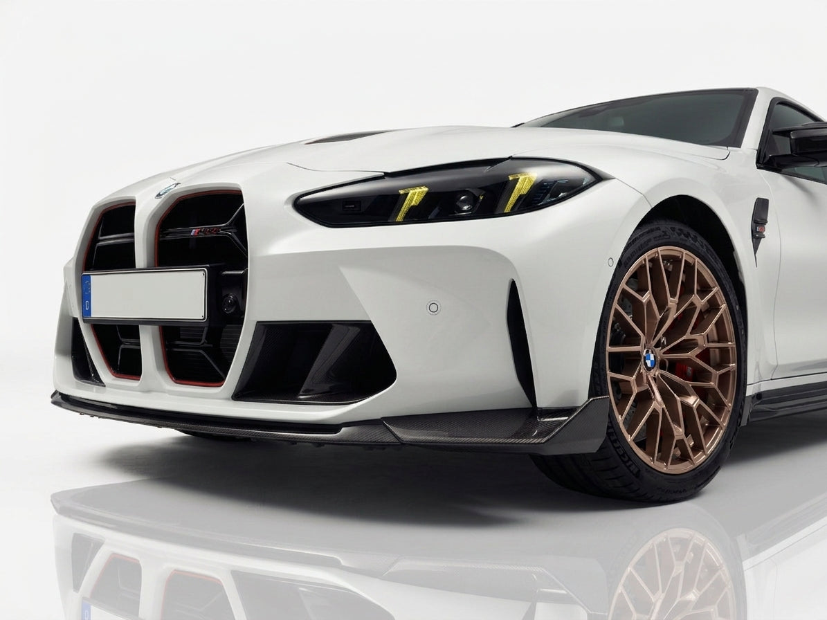 Carbon Corp. CSL style carbon fibre front splitter installed on a white BMW M4 G82 with yellow daytime running lights.